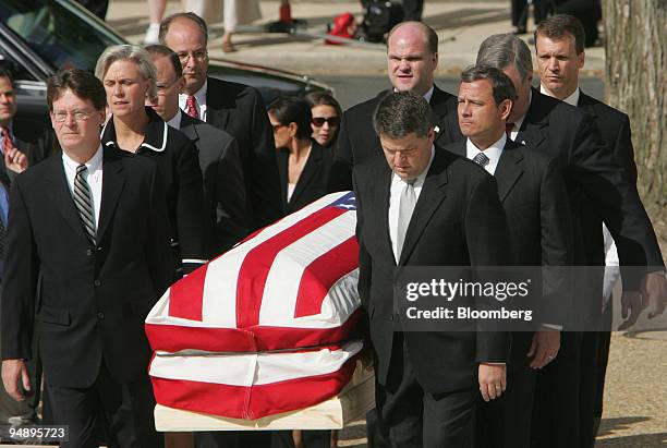 Supreme Court Chief Justice nominee John Roberts, second right, joins other former law clerks of the late Supreme Court Justice William Rehnquist as...