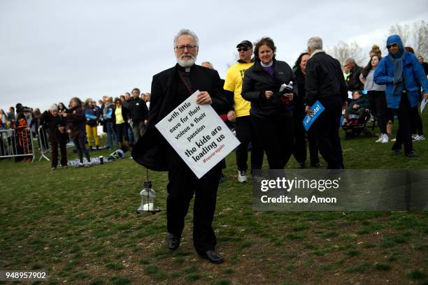 Father Michael Nicosia, Vicar for the Rocky Mountain Region of the Ecumenical Catholic Communion heads to the stage to speak with other religious...