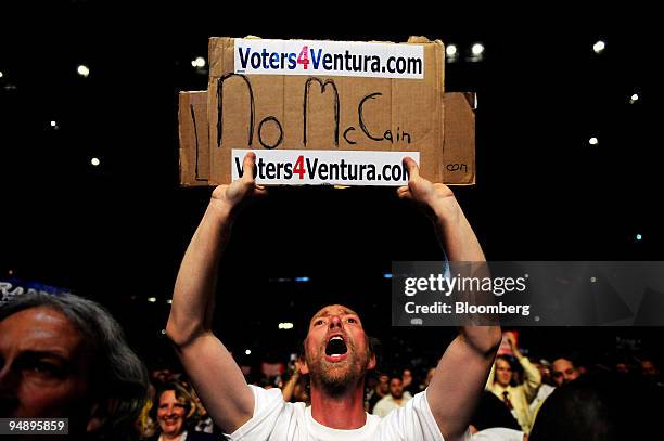 Kenny Karolch-Griffin cheers on Jesse Ventura, former governor of Minnesota, as he speaks during Rally for the Republic, an event in support of Ron...