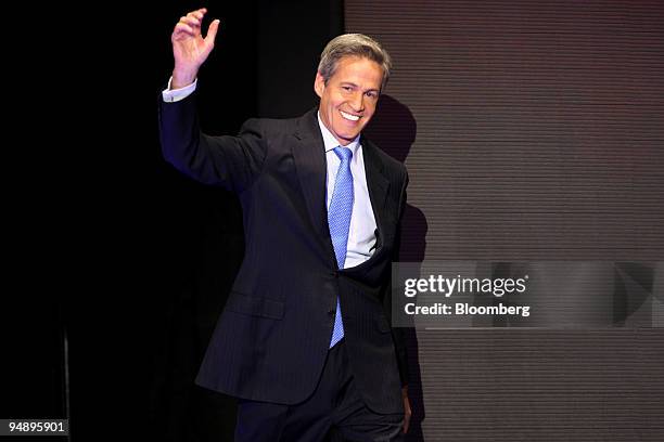 Norm Coleman, a Republican senator from Minnesota, waves at the audience on day two of the Republican National Convention at the Xcel Energy Center...