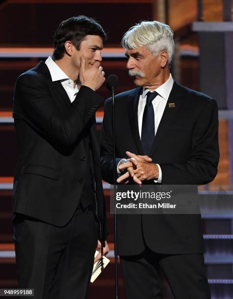 Ashton Kutcher and Sam Elliott present an award during the 53rd Academy of Country Music Awards at MGM Grand Garden Arena on April 15, 2018 in Las...