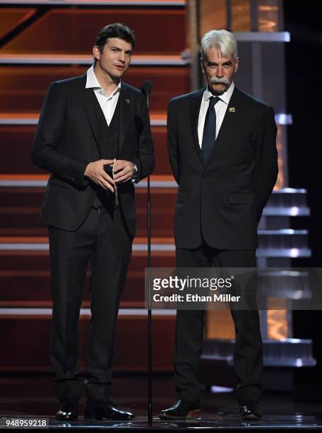 Ashton Kutcher and Sam Elliott present an award during the 53rd Academy of Country Music Awards at MGM Grand Garden Arena on April 15, 2018 in Las...