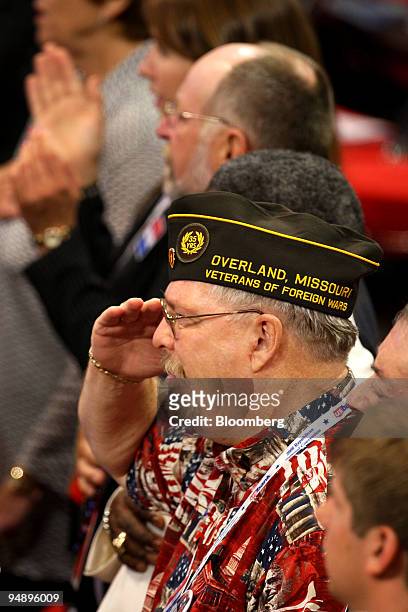 Member of the Veterans of Foreign Wars , salutes during the invocation on day two of the Republican National Convention at the Xcel Energy Center in...