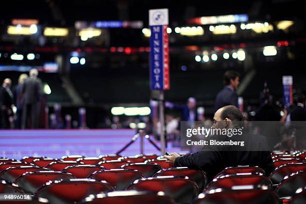 An attendeee checks his mobile phone before the start of day two of the Republican National Convention at the Xcel Center in St. Paul, Minnesota,...