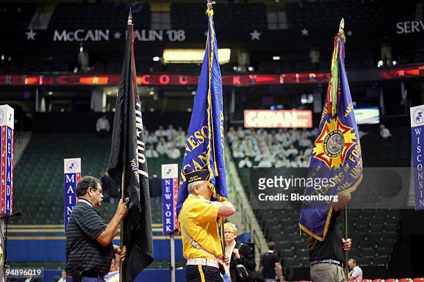Veterans of Foreign Wars members take part in a rehearsal before the start of day two of the Republican National Convention at the Xcel Center in St....