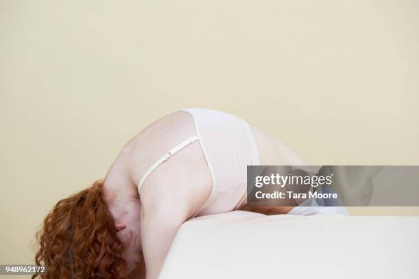 woman lying on table - woman sleeping table stock pictures, royalty-free photos & images