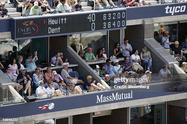 Fans watch a match between Lleyton Hewitt and Taylor Dent on September 4, 2005 from a MassMutual Financial Group suite at the U.S. Open tennis...