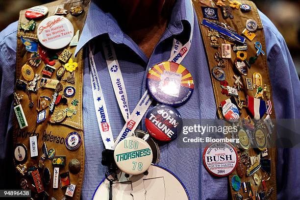 Republican delegate wears pins on a vest on day one of the Republican National Convention at the Xcel Center in St. Paul, Minnesota, U.S., on Monday,...