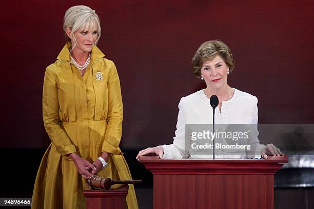 First Lady Laura Bush, wife of U.S. President George W. Bush, right, speaks as Cindy McCain, wife of assumed Republican presidential candidate U.S....