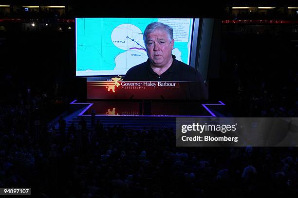 Haley Barbour, governor of Missisippi, speaks via recorded video message to delegates on day one of the Republican National Convention at the Xcel...