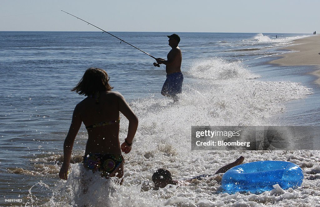Ben Hess fishes in the Atlantic Ocean off of Main Beach in E