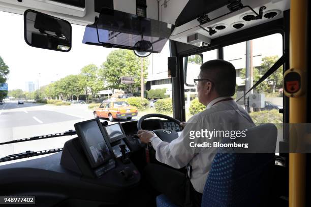 Driver operates a Toyota Motor Corp. Sora fuel-cell bus during a test-drive event event in Tokyo, Japan, on Friday, April 20, 2018. Toyota aims to...