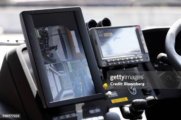 Monitor shows various views from the field-of-vision support camera system onboard a Toyota Motor Corp. Sora fuel-cell bus during a test-drive event...