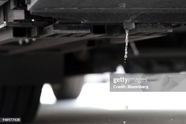 Water drips from the tailpipe of a Toyota Motor Corp. Sora fuel-cell bus during a test-drive event in Tokyo, Japan, on Friday, April 20, 2018. Toyota...
