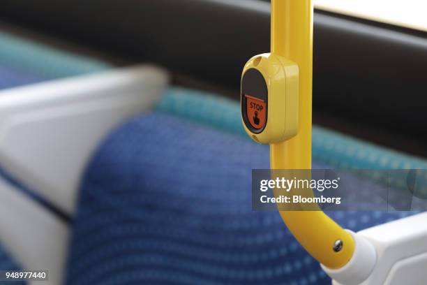 Stop button is seen onboard a Toyota Motor Corp. Sora fuel-cell bus during a test-drive event in Tokyo, Japan, on Friday, April 20, 2018. Toyota aims...