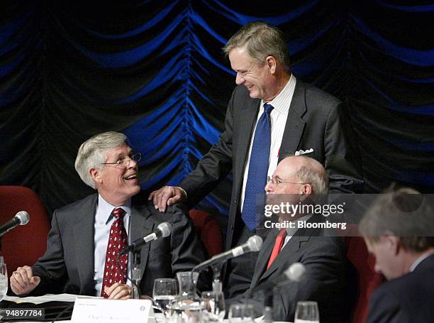 Chairman Connie Mack, left, and Vice Chairman John Breaux, standing, share a lighter moment as former Internal Revenue Service Commissioner and panel...