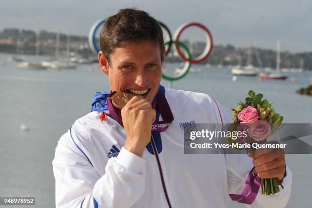 Jonathan Lobert of France celebrates finishing third in the Men's Finn Sailing on Day 9 of the London 2012 Olympic Games at the Weymouth & Portland...