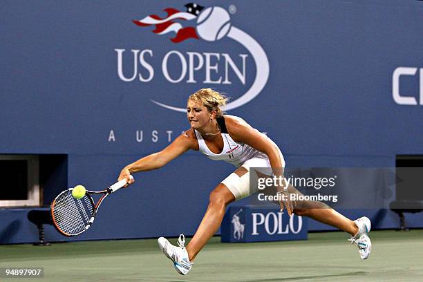 Timea Bacsinszky of Switzerland returns to Dinara Safina of Russia during their singles tennis match on day six of the U.S. Open at the Billie Jean...