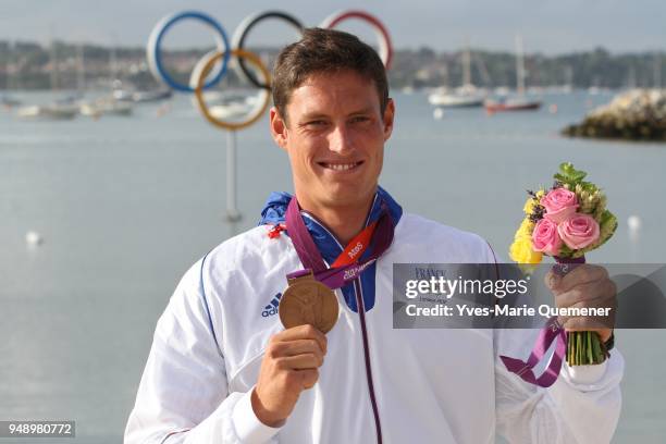 Jonathan Lobert of France celebrates finishing third in the Men's Finn Sailing on Day 9 of the London 2012 Olympic Games at the Weymouth & Portland...