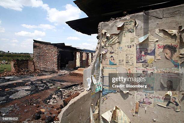 The shell of homes, torched during clashes following the Kenyan elections, stand in Eldoret, Kenya, on Saturday, Feb. 16, 2008. As many as 400 people...