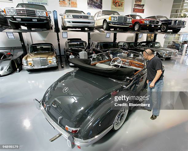 Ali Rezai of Mission Viejo, California, looks at the interior of a 1956 Mercedes-Benz 300SC valued at $500,000 in the showroom of the Mercedes-Benz...