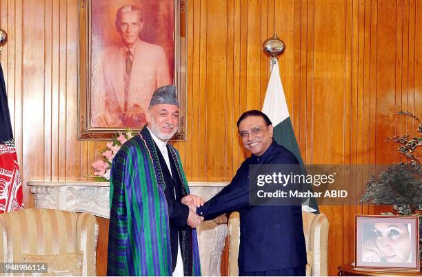 President Asif Ali Zardari shakes hand with his Afghan counterpart, Hamid Karzai during meeting at Aiwan-e-Sadr in Islamabad on Friday, June 10, 2011.