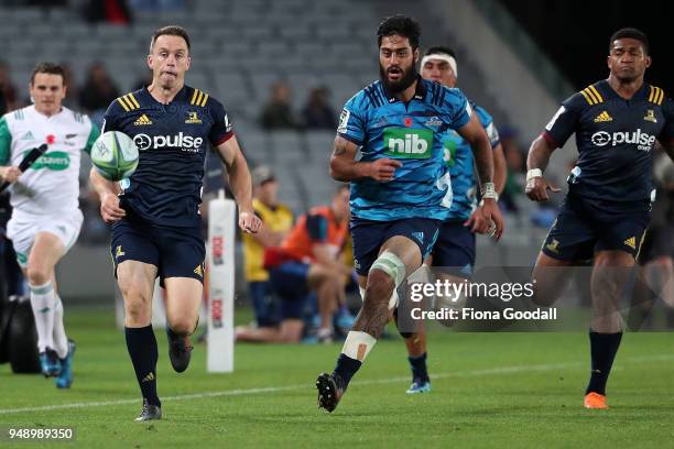 Ben Smith co-captain of the Highlander and Akira Ioane of the Blues chase the ball during the round 10 Super Rugby match between the Blues and the...