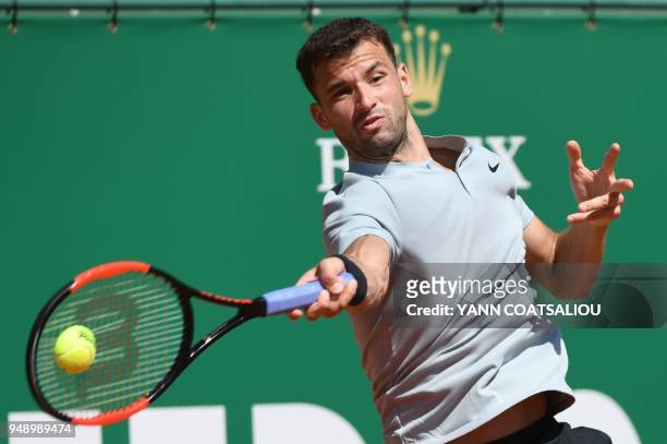 Bulgaria's Grigor Dimitrov plays a forehand return to Belgium's David Goffin during their singles tennis match at the Monte-Carlo ATP Masters Series...