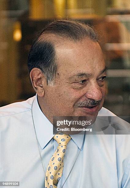 Billionaire Carlos Slim Helu, whose companies include Mexico City-based Telefonos de Mexico SA and America Movil SA DE CV, smiles during a luncheon...