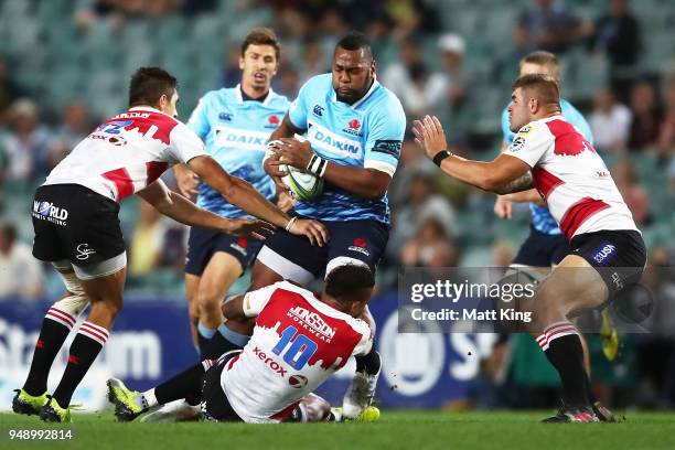 Taqele Naiyaravoro of the Waratahs is tackled during the round 10 Super Rugby match between the Waratahs and the Lions at Allianz Stadium on April...