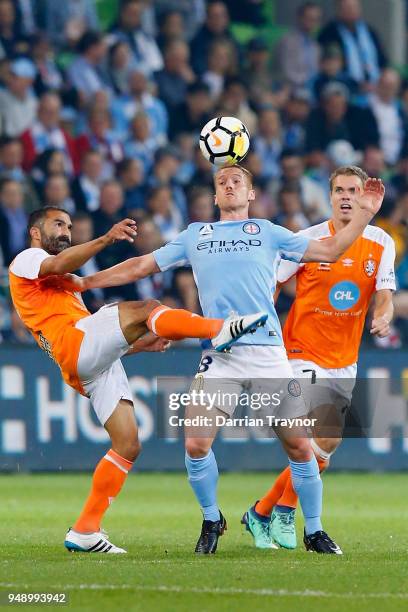 Fahid Ben Khalfallah of the Roar and Oliver Bozanic of Melbourne City compete during the A-League Elimination Final match between the Melbourne City...