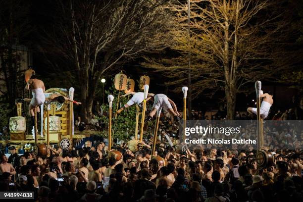 Half-naked festival-goers perform acrobatics for good luck during the first day of Furukawa Matsuri on April 19, 2018 in Hida, Japan. Furukawa...