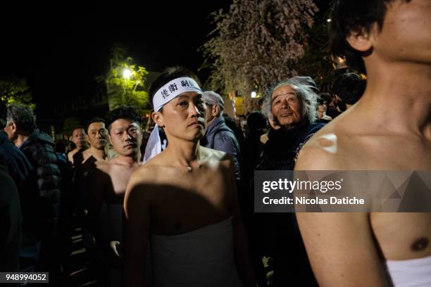 Half-naked festival-goers waits before to perform acrobatics for good luck during the first day of Furukawa Matsuri on April 19, 2018 in Hida, Japan....