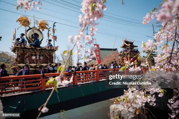 Big floats called Yatai stop on bridge on second day of Furukawa Matsuri on April 20, 2018 in Hida, Japan. Furukawa Matsuri, an annual two-day...