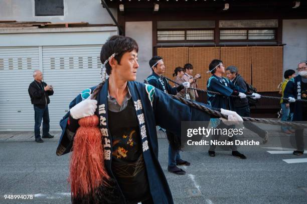 Festival-goers hold a long rope used to move the big float during the first day of Furukawa Matsuri on April 19, 2018 in Hida, Japan. Furukawa...