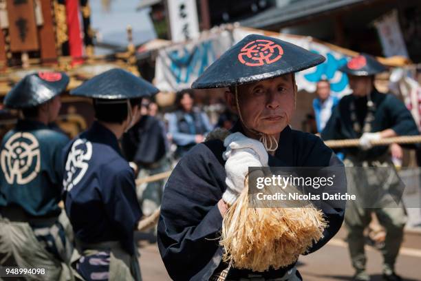 Festival-goer holds a long rope used to move big float called Yatai during the second day of Furukawa Masturi on April 20, 2018 in Hida, Japan....