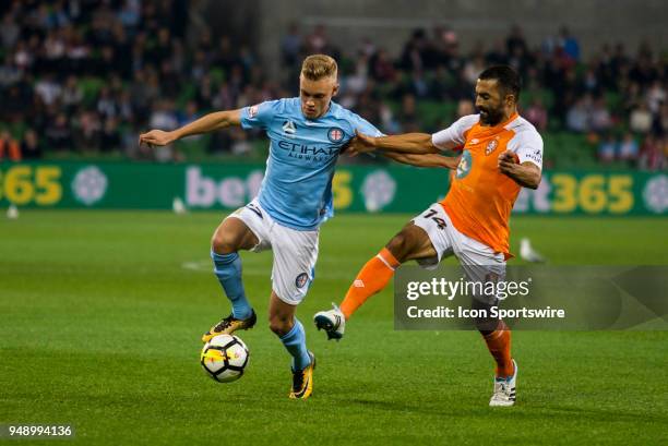 Nathaniel Atkinson of Melbourne City and Fahid Ben Khalfallah of the Brisbane Roar contest the ball during the Elimination Final of the Hyundai...