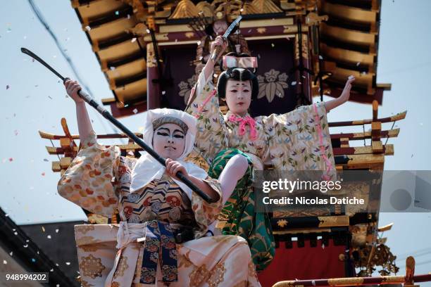 Two kids play traditional kabuki on a float during the second day of Furukawa Masturi on April 20, 2018 in Hida, Japan. Furukawa Matsuri, an annual...