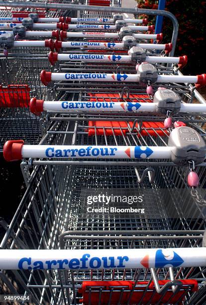 Shopping carts can be seen in the parking lot of a Carrefour supermarket in Alencon, France on Saturday, August 27, 2005. Carrefour SA, the world's...