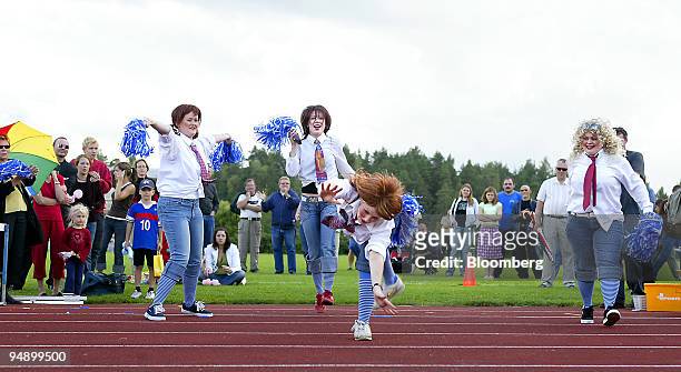 Four girls on Team Tanen Enkelit perform in the Freestyle class during the sixth annual Mobile-Phone Throwing World championships in Savonlinna,...