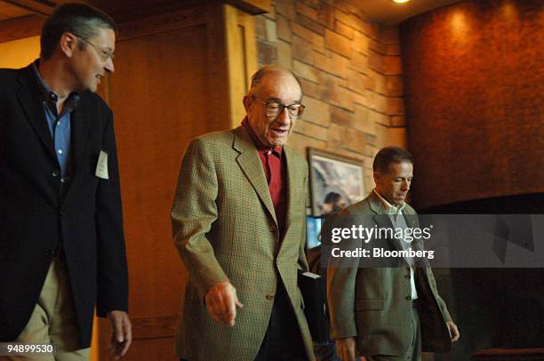 Alan Greenspan, Chairman of the Federal Reserve Board, center, arrives for breakfast at the Jackson Lake Lodge in Teton National Park in Wyoming,...