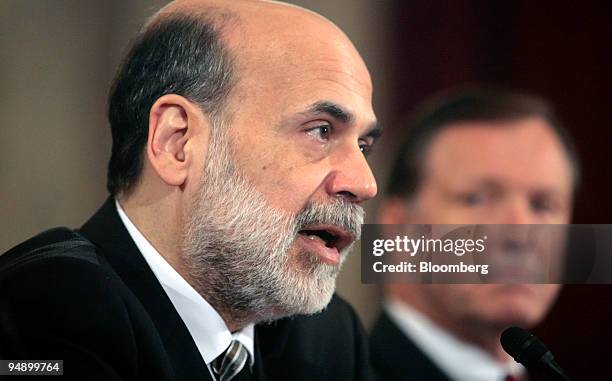 Christopher Cox, chairman of the U.S. Securities and Exchange Commission, right, listens to Ben S. Bernanke, chairman of the U.S. Federal Reserve,...