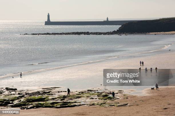 Walkers make their way along Longsands beach on April 20, 2018 in Tynemouth, United Kingdom. Britain continues to bask in the hottest weather of 2018...
