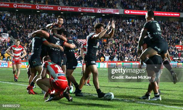 Warriors players celebrate the try of Isaiah Papali'i during the round seven NRL match between the New Zealand Warriors and the St George Illawarra...