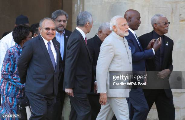 India's President Narendra Modi and Prime Minister of Papua New Guinea Peter O'Neill join other Commonwealth heads of government as they arrive at...