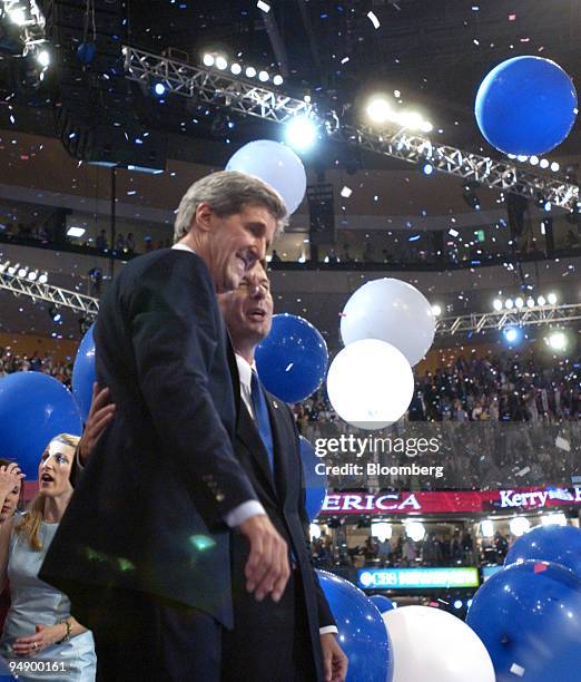 Democratic Presidential nominee Sen. John Kerry, left, and his running mate Sen. John Edwards are seen after Kerry addressed the final session of the...
