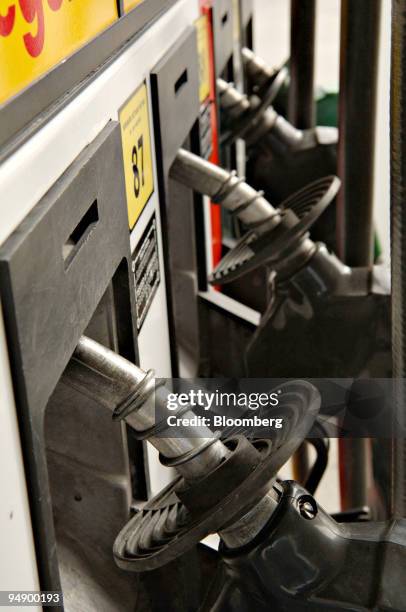 Gas filler hoses await customers at a Shell station in Anchorage, Alaska, Thursday, August 25, 2005.