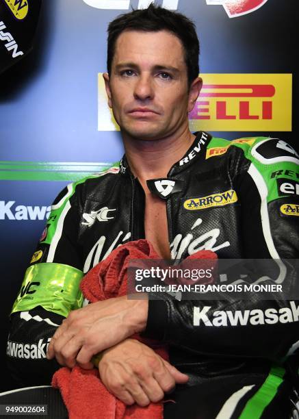 France's rider Randy De Puniet looks on in the pits after his team qualified for the pole position during a qualifying session in Le Mans,...