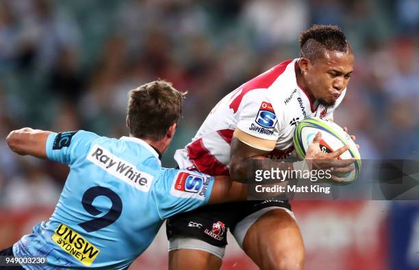 Elton Jantjies of the Lions is tackled during the round 10 Super Rugby match between the Waratahs and the Lions at Allianz Stadium on April 20, 2018...