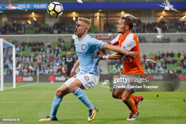 Nathaniel Atkinson of Melbourne City and Eric Bautheac of the Roar compete during the A-League Elimination Final match between the Melbourne City and...